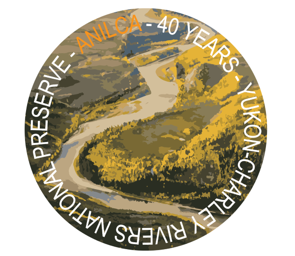 Fall colors on the Yukon river with text in a circle - ANILCA 40 years Yukon-Charley Rivers National Preserve