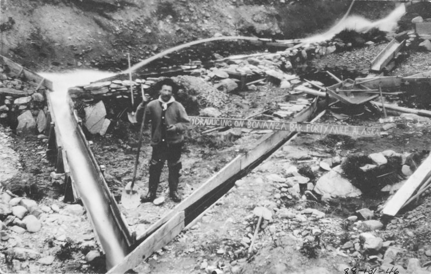 Hydraulicking with sluices boxes near the Fortymile River , ca. 1915.