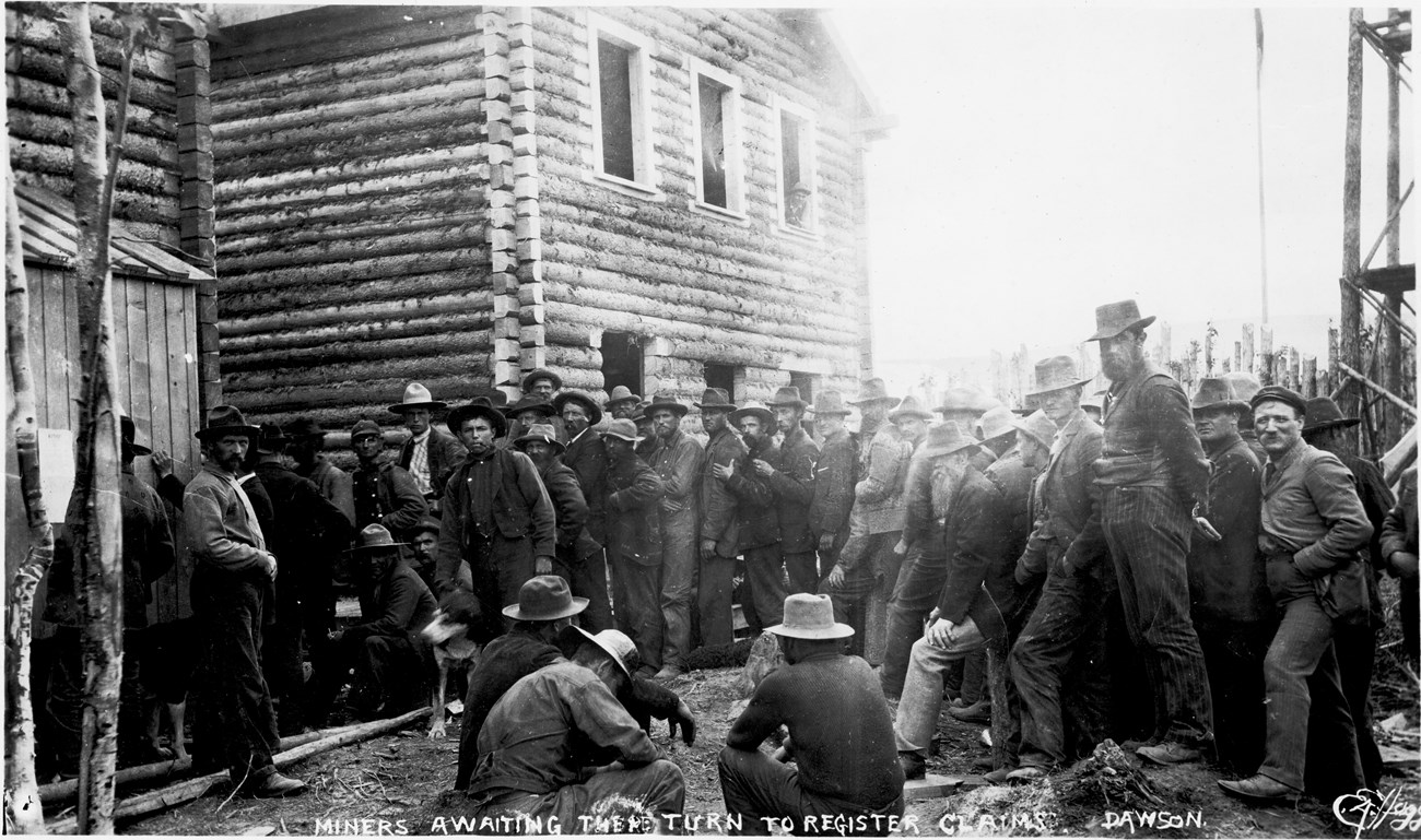 Miners in Dawson City queuing to register gold claims, 1898.