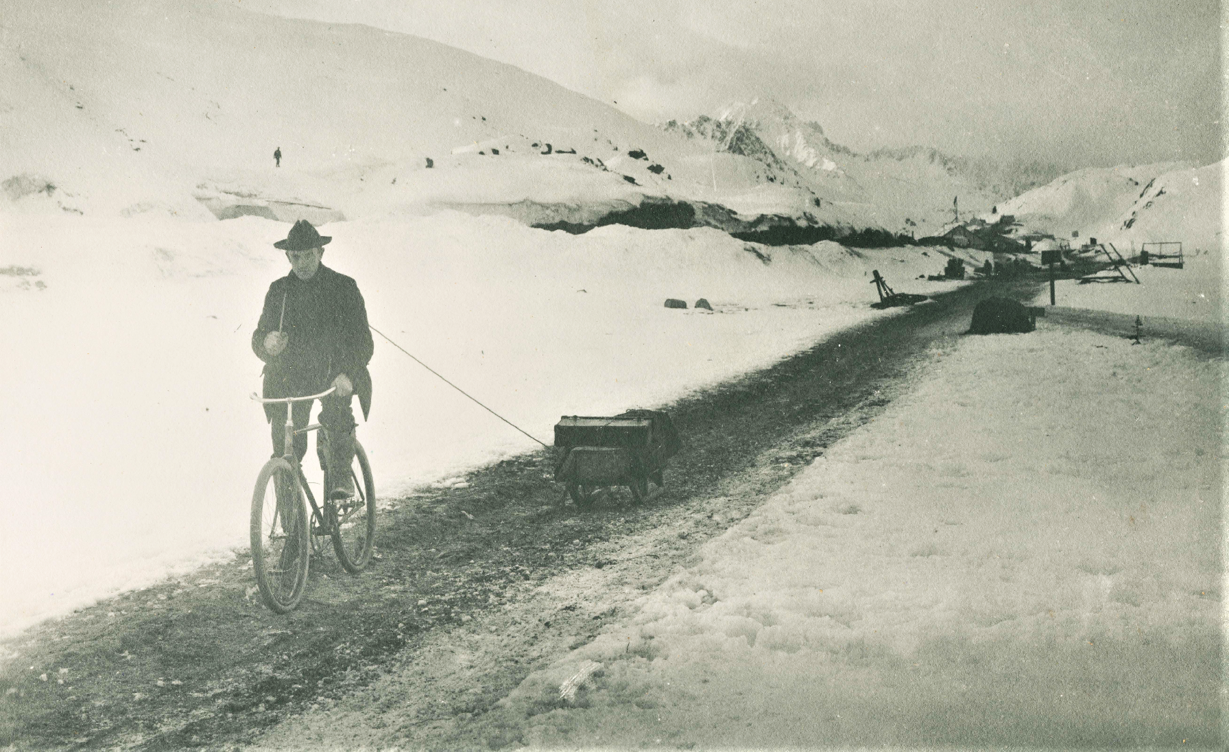 Arthur Pillsbury riding his bike at White Pass above Skagway, Alaska in winter