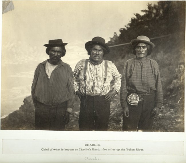 First known photo of Chief Charley, center. Taken on the Yukon River in 1882.