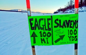 A sign for Slaven's Roadhouse on the Yukon River