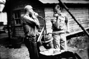 Dale Patty and Ted Murray retorting Coal Creek gold.