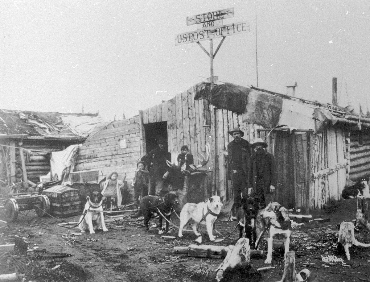 Residents of the newly established Alaskan town of Star City assemble in front of their post office, ca. 1899