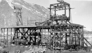 Historic photo of the Coal Creek gold dredge under construction in 1935.