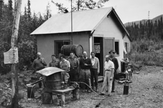 McRae, Patty, and friends watching the process of removing mercury from gold, circa 1930s.
