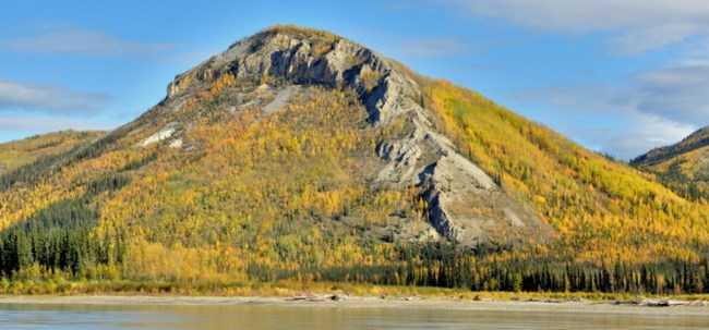 The tall Tahkandit Limestone bluffs near Nation River