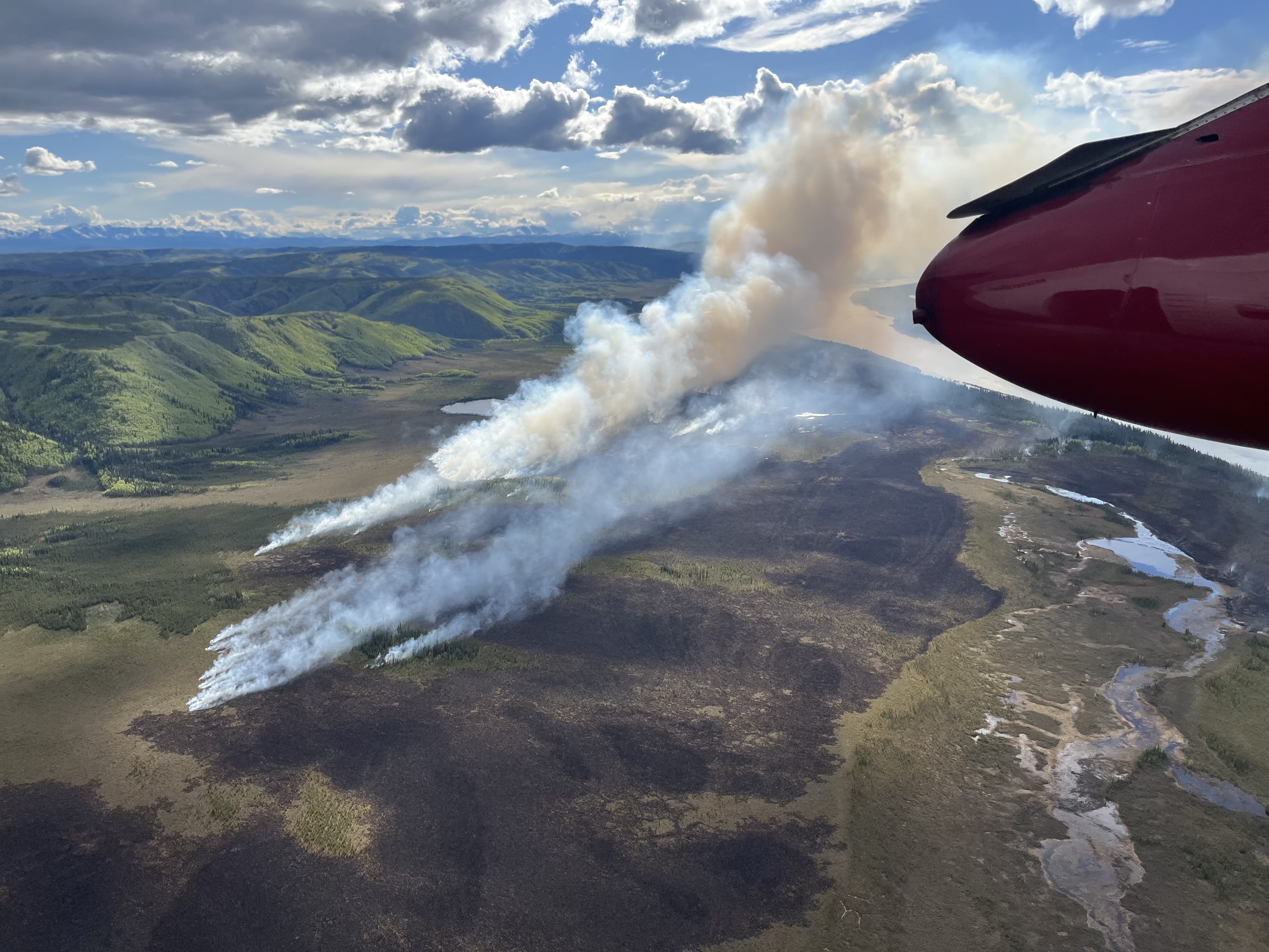 Aerial view of a wildland fire next to the Yukon River Aerial view of a wildland fire next to the Yukon River