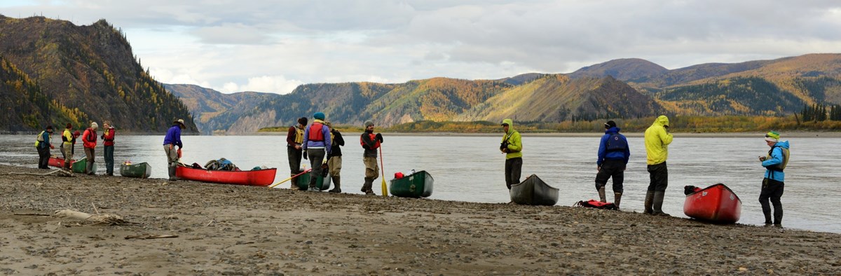 A group canoeing on the Yukon River