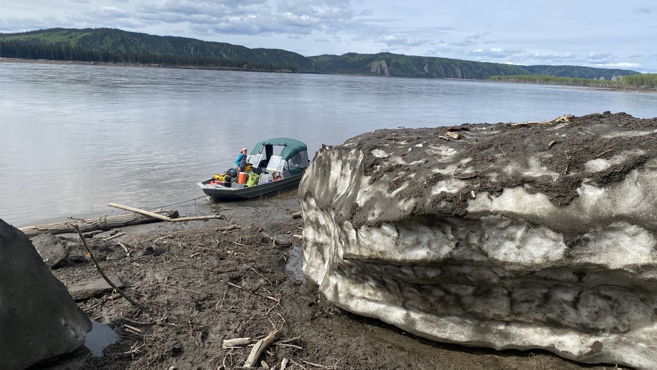 A river boat on shore at the Smith Public Use Cabin site, showing the size of the remaining icebergs, June 14, 2023.