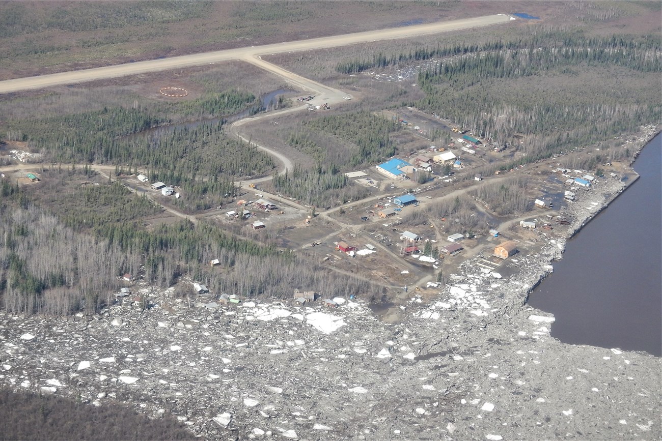Aerial view of river ice and damaged cabins along the shoreline at Circle City, May 15, 2023.