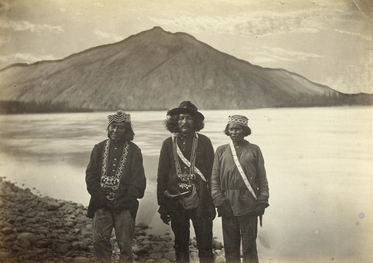 Historic photograph of three Tanana Alaska Natives near what is now Eagle Village on the Yukon River with Eagle Bluff in the background Historic photograph of three Tanana Alaska Natives near what is now Eagle Village on the Yukon River with Eagle Bluff in the background