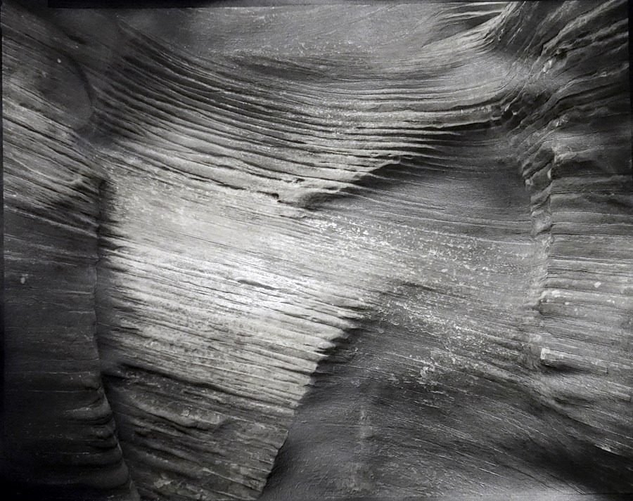 Black and white detail photo of smooth sandstone texture