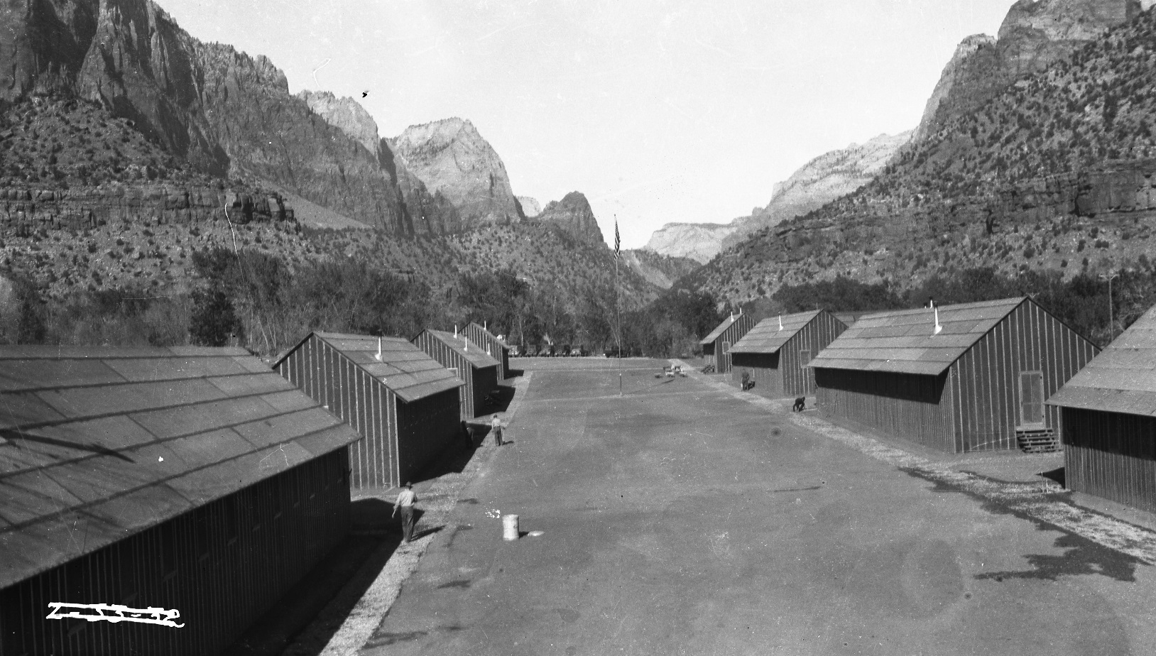 The CCC camps located in Zion Canyon were constructed in a horseshoe shape, with two main rows of structures and a courtyard area in between. This photo shows Camp NP-4, Bridge Mountain Camp, which was located on the east side of the Virgin River.