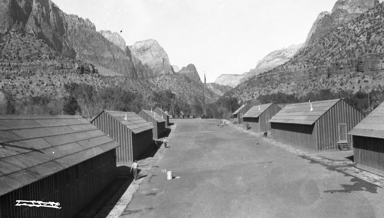 The CCC camps located in Zion Canyon were constructed in a horseshoe shape, with two main rows of structures and a courtyard area in between. This photo shows Camp NP-4, Bridge Mountain Camp, which was located on the east side of the Virgin River.