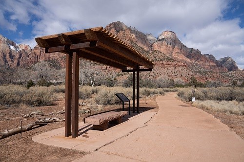 A stop along the Pa'Rus Trail offering a paved, shaded shelter, with a bench and a wheelchair accessible wayside.