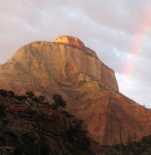 rainbow and sunset light on the East Temple