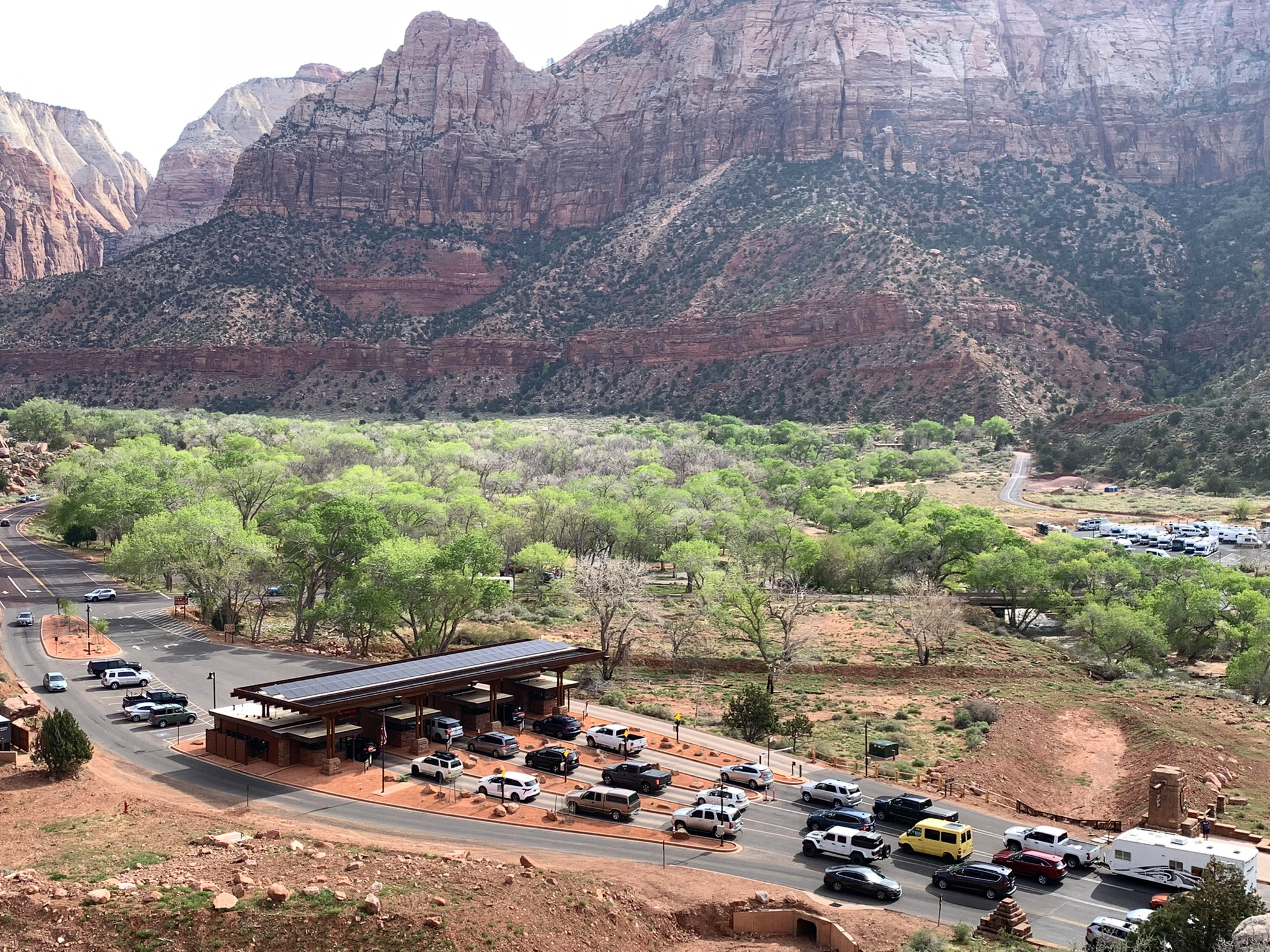 Vehicles in a line at Zion National Park South Entrance fee stations.