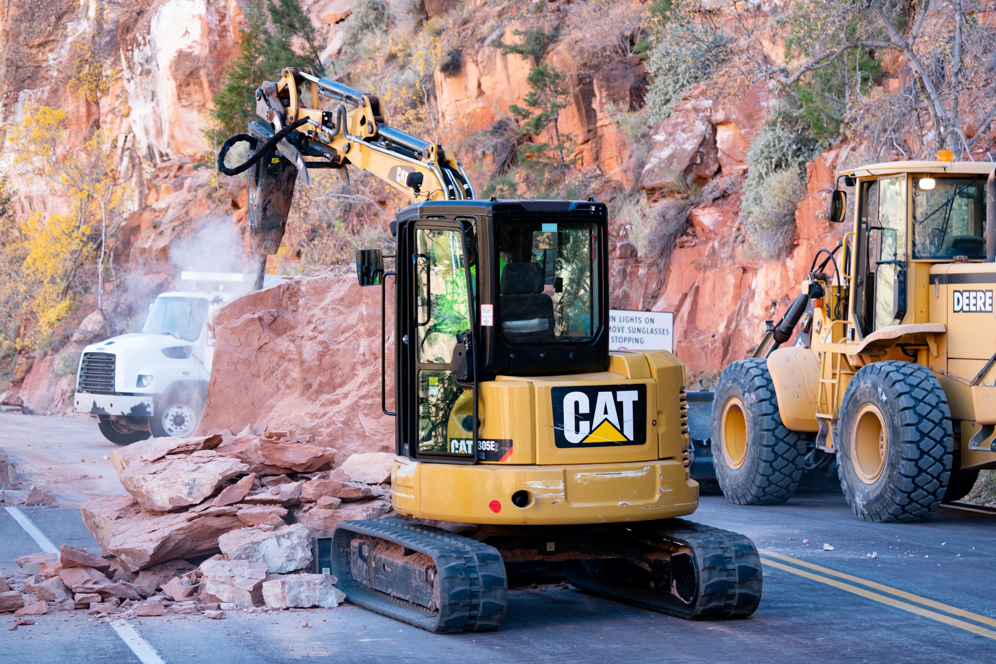 Heavy machinery clearing fallen rock near western end of Zion-Mount Carmel Tunnel.