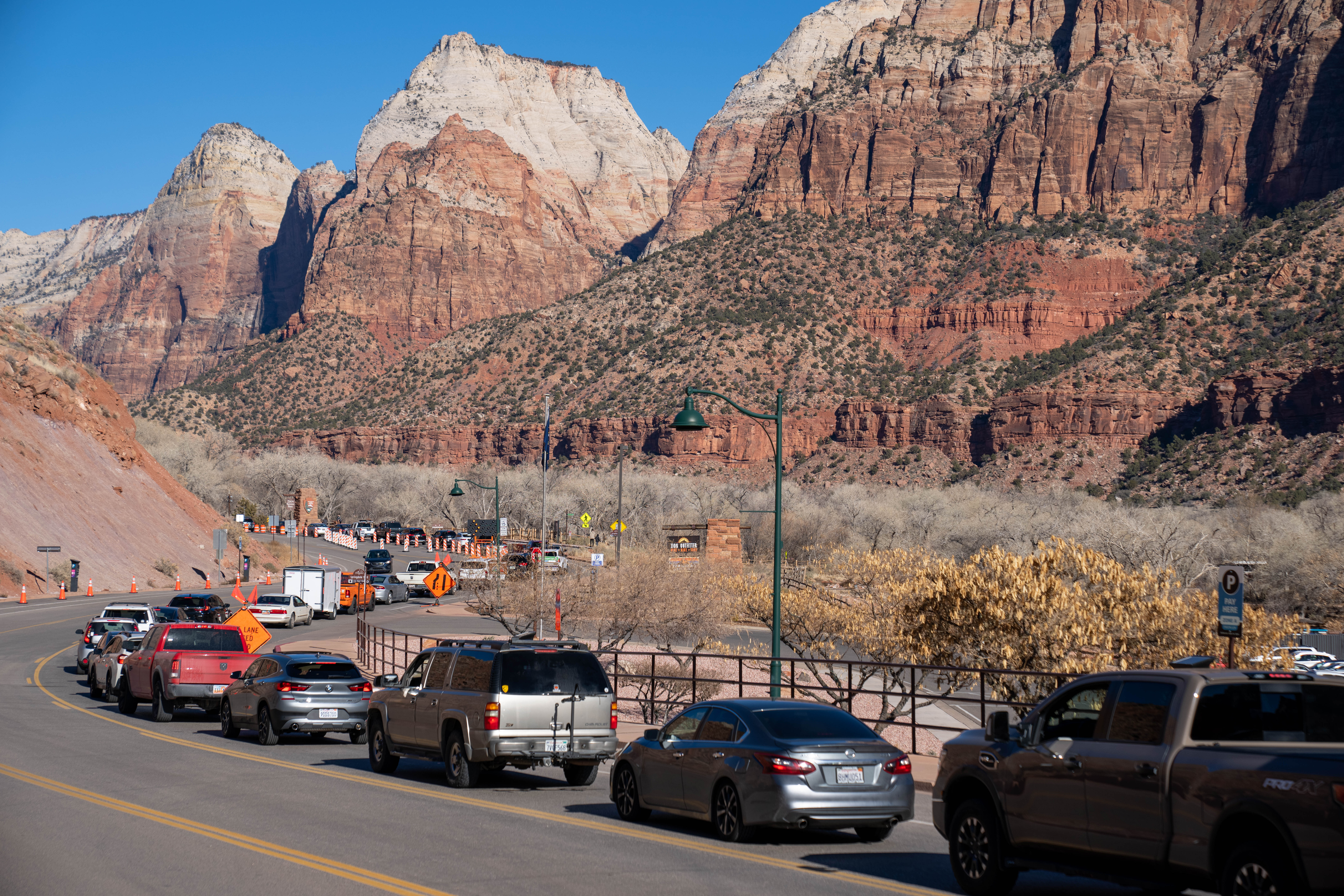 Cars lined up on the road to enter the South Entrance of Zion National Park