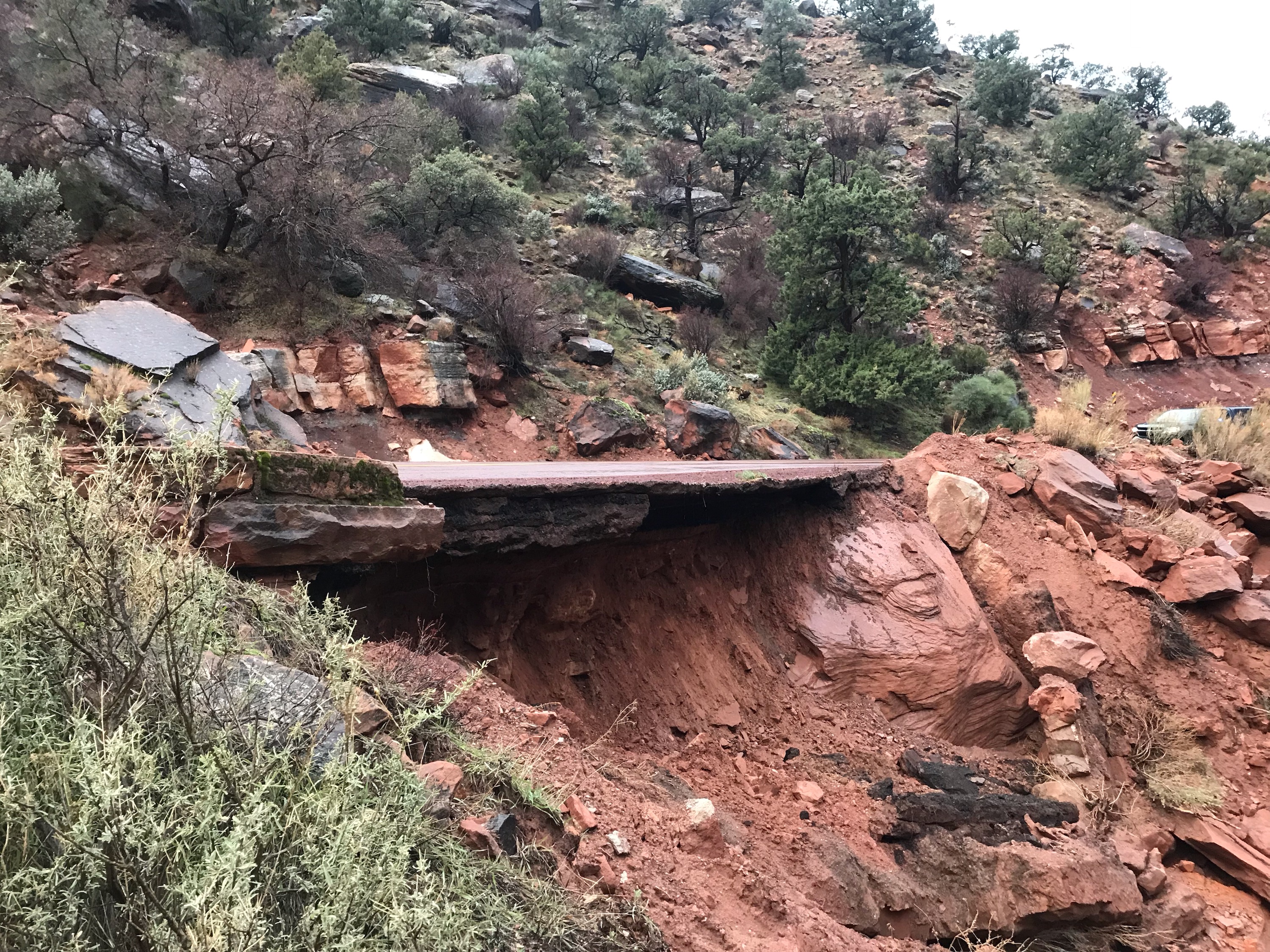 Zion Mt Carmel Hwy washout soil has been washed out from under the road