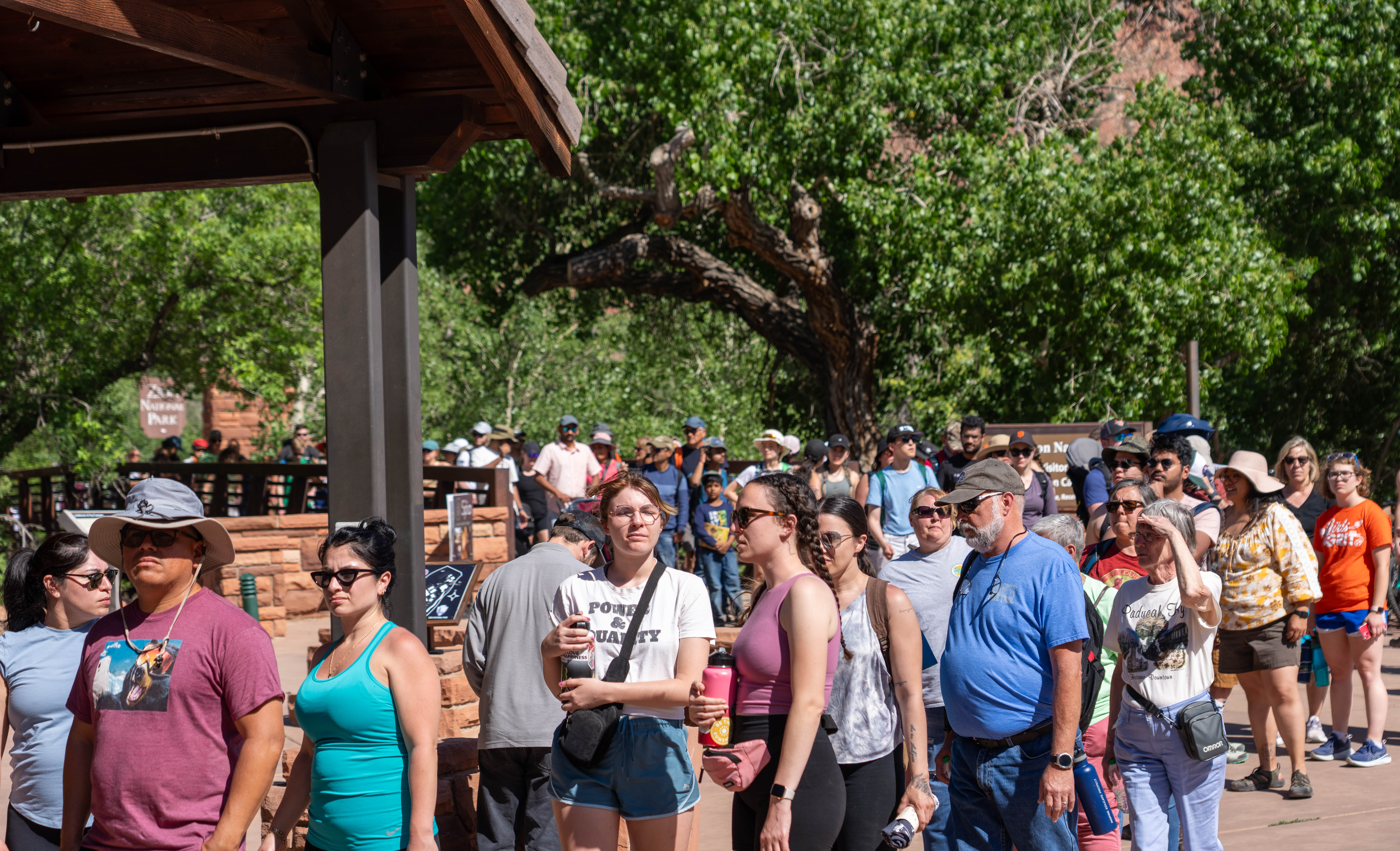People stand in line near the entrance of Zion National Park