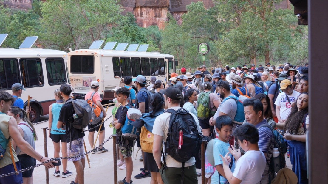 Busy visitation in Zion National Park A long line of visitors wait for the Zion Canyon shuttle
