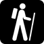 black and white icon of a person hiking