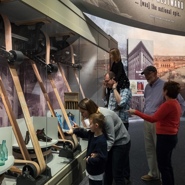 people examining turning mercantile display in the Manifest Destiny gallery