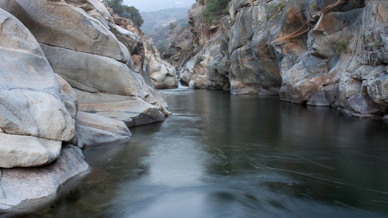 A river flows through a steep rocky canyon. Photo by Naoko Otani.