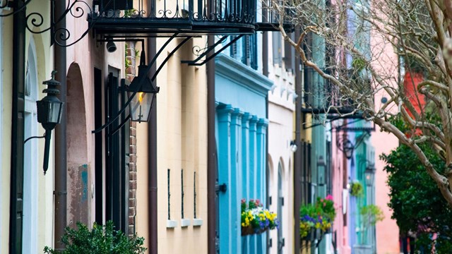 Side shot of a row of historic buildings. 