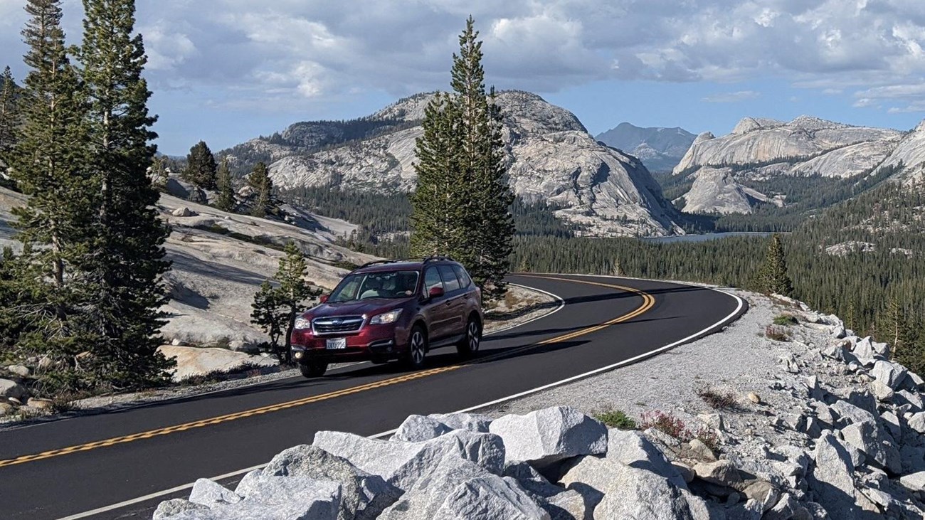 Car traveling along the Tioga Road in summer