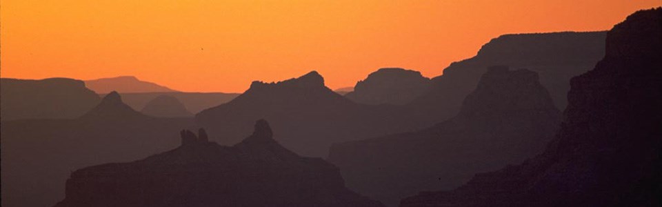 Sun behind the canyon at sunset.